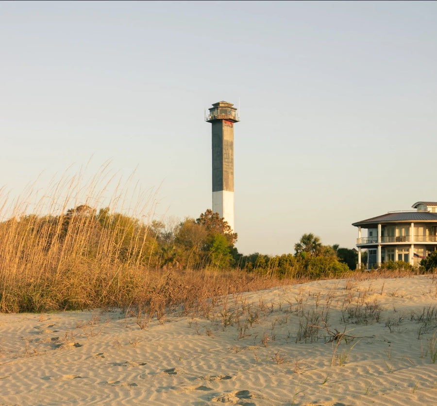 Sullivan's Island lighthouse above the dunes at golden hour