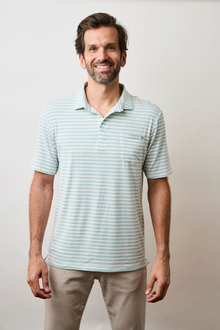 Model wearing the Coastal Soft Stretch polo in Large