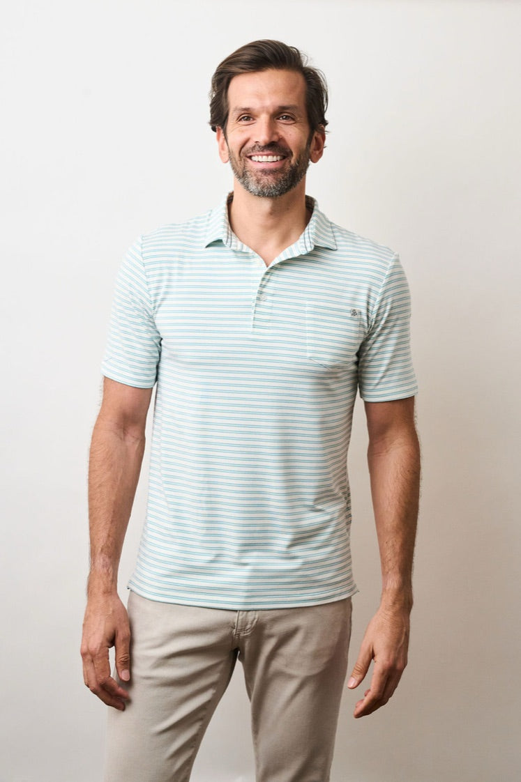 Model wearing the Coastal Soft Stretch polo in Medium